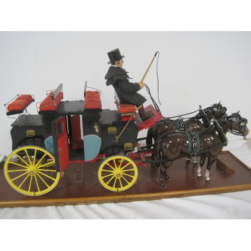 1 - A vintage model of an English Stage Coach and Horses in a perspex display mount with wooden base, in... 