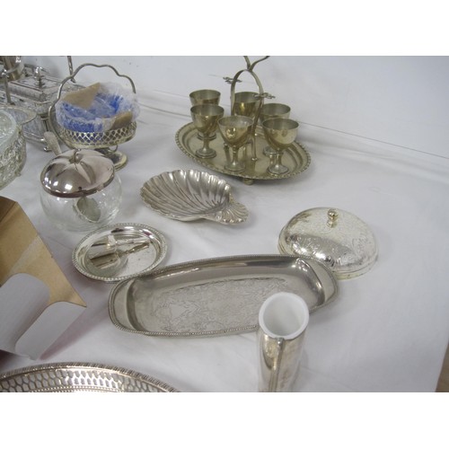 19 - An assortment of electroplated dining and table ware, including trays, goblets, egg cruets, cutlery,... 