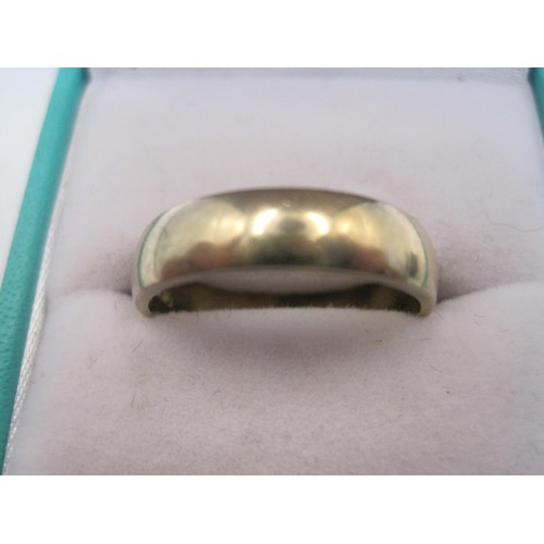 154 - 9 carat gold wedding ring, size P, weight approx. 3.5g, British hallmarks. With a simple plastic rin... 