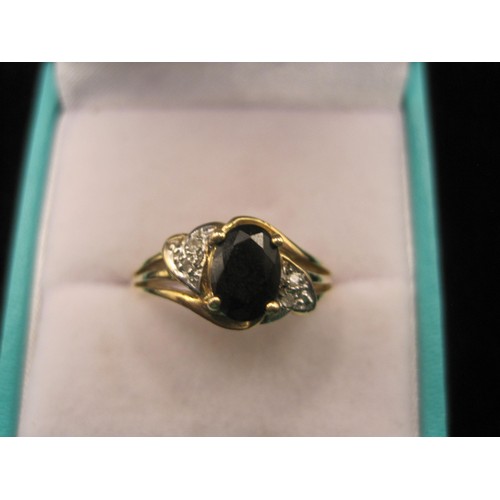 164 - Two 9 carat gold sapphire dress rings. (1) Ring set with an oval sapphire (about 7mm x 5mm) with two... 