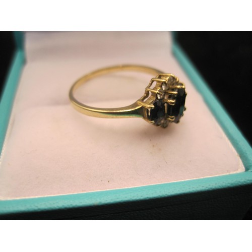 164 - Two 9 carat gold sapphire dress rings. (1) Ring set with an oval sapphire (about 7mm x 5mm) with two... 