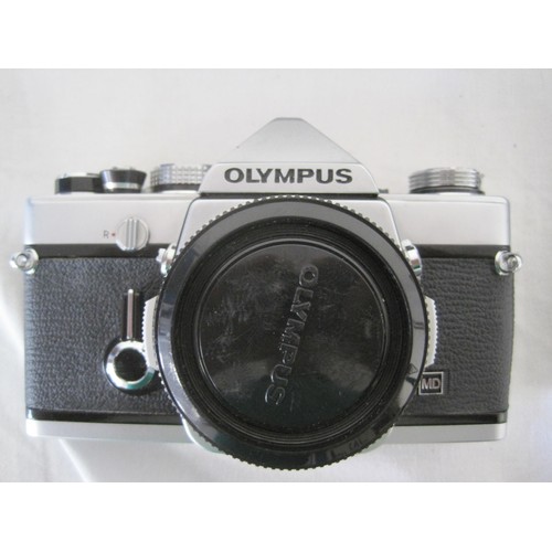 167 - A complete Olympus OM-10 35mm SLR Camera Outfit including vivitar 28/200, vivitar 70/210 tokina 80/2... 