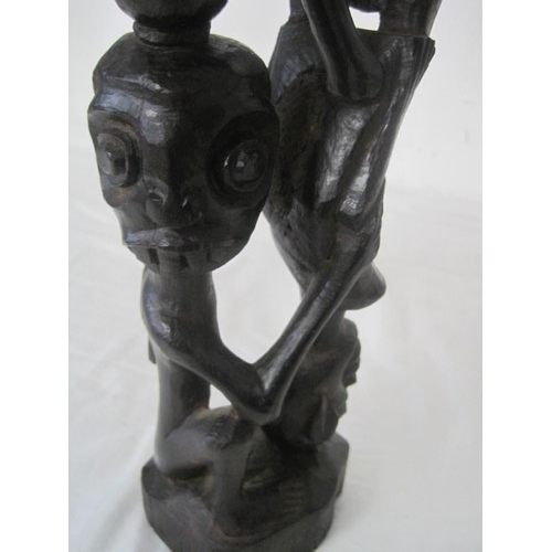 139 - A Makonde Tree of Life carved wooden totem figure (height 54cm)