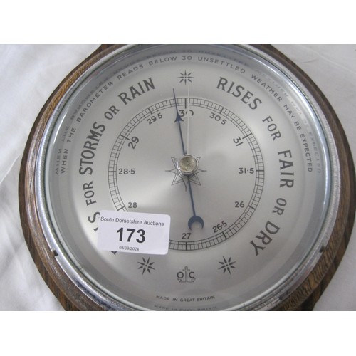 173 - An oak mounted aneroid barometer and thermometer, marked made in Great Britain