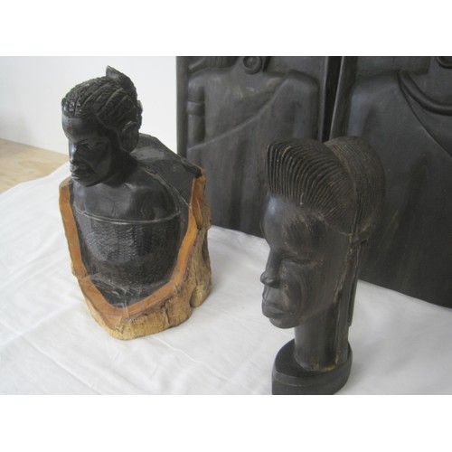 141 - Tribal carved wood - a figure of mother and child (height 25cm), a girl's head, and two profile wall... 