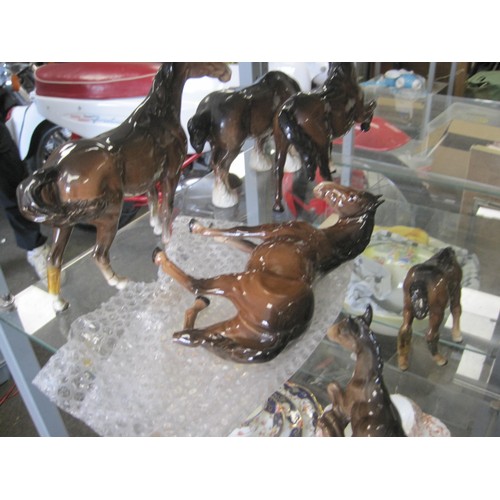 41 - A Beswick chestnut stallion and a Beswick shire horse in very good condition, together with two a/f ... 