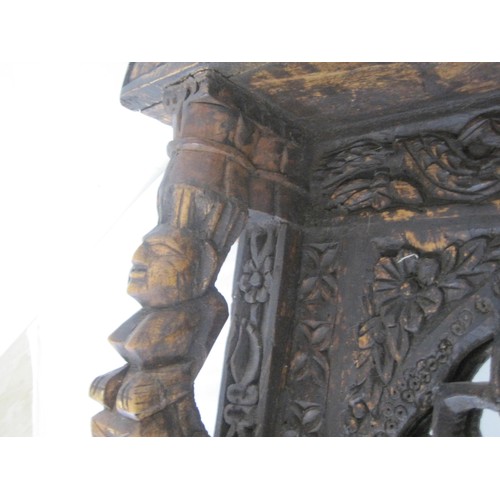 47 - Dark Wood, ornately carved mirror approx. 24in tall