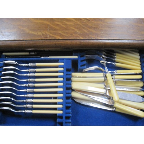 15 - An antique service of cutlery by WMF in an oak case, in good order