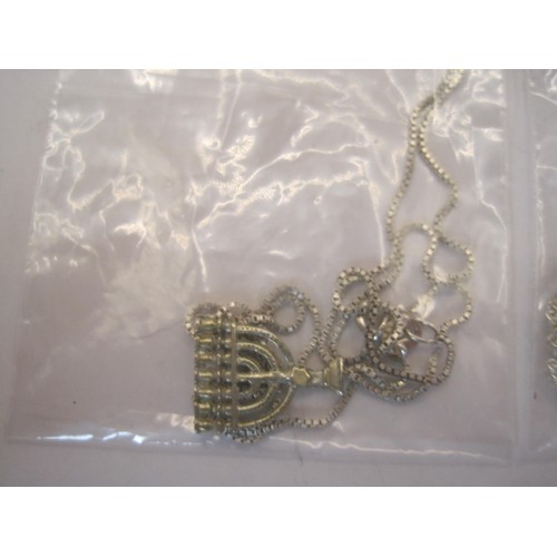 200 - Three necklaces and pendants  - (1) a Libra star sign pendant stamped silver on a chain. (2)a pierce... 