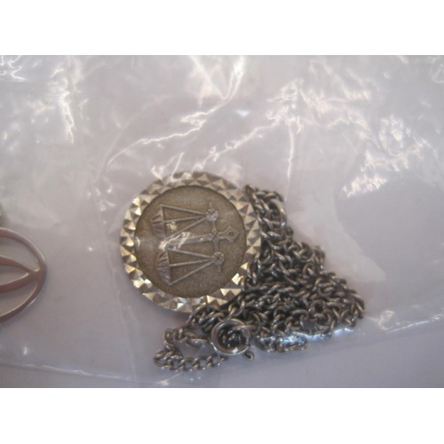 200 - Three necklaces and pendants  - (1) a Libra star sign pendant stamped silver on a chain. (2)a pierce... 