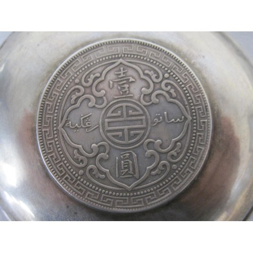 110 - A Wai Kee Chinese export silver dish inset with a 1912 Hong Kong trade dollar. A/f the dish is sligh... 