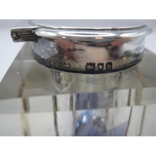 216 - A cuboid glass inkwell with silver mounts, approximate dimensions 5cm x 4.7cm x 5cm. Marks for Londo... 