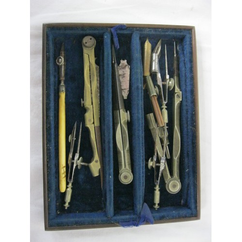 220 - An antique draughtsman's or drawing set, contained in a hardwood brass-bound case, two lift-out tray... 