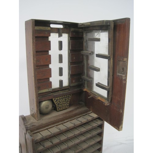 7 - An antique coin sorter on wooden stand with manufacturer's plate for J C Cox of Queen Victoria Stree... 