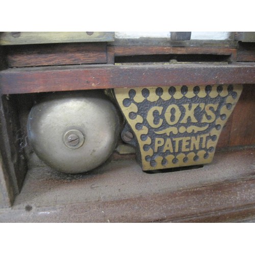 7 - An antique coin sorter on wooden stand with manufacturer's plate for J C Cox of Queen Victoria Stree... 