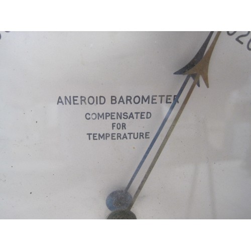 14 - A vintage Negretti & Zambra of Aylesbury Aneroid Barometer compensated for temperature, brass and st... 