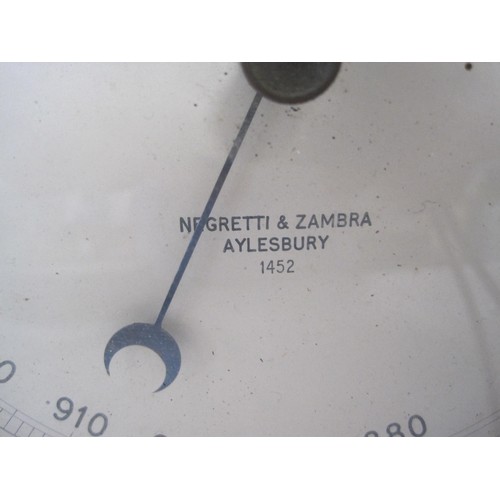 14 - A vintage Negretti & Zambra of Aylesbury Aneroid Barometer compensated for temperature, brass and st... 