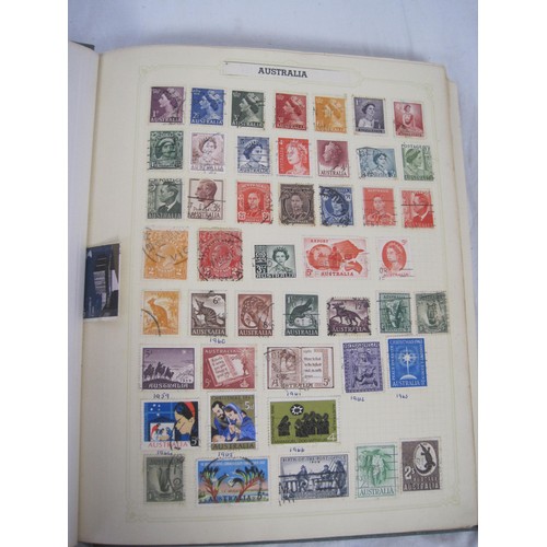 65 - A green Simplex Medium Stamp Album containing world stamps and one GB error stamp - a 1966 Christmas... 