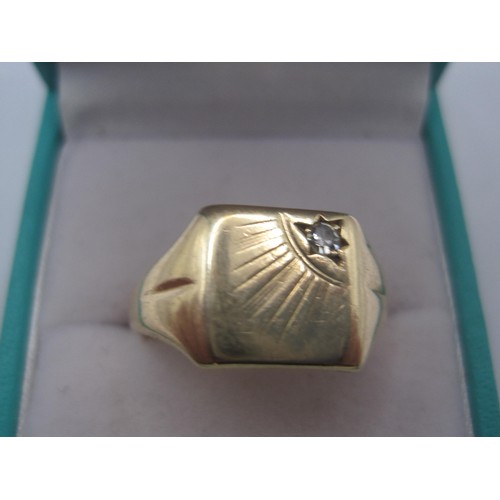 25 - A Gentlemens signet ring size T 9 CT gold 4.20 grams with a small stone in one corner