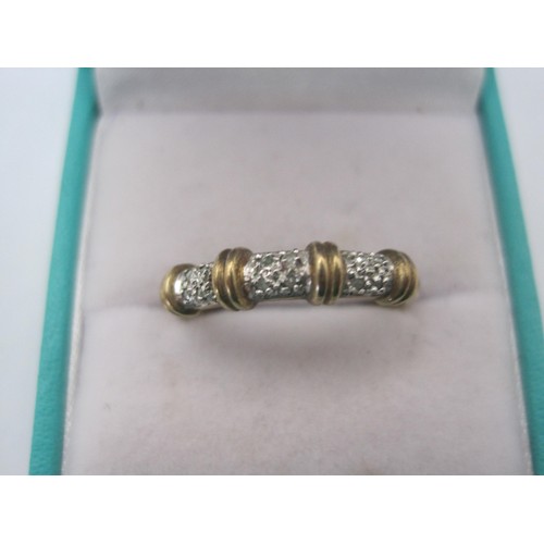 28 - A 375 hallmarked gold ring in size s  featuring some very small stones as decoration .
weight 1.6 gr... 