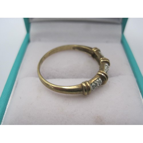 28 - A 375 hallmarked gold ring in size s  featuring some very small stones as decoration .
weight 1.6 gr... 