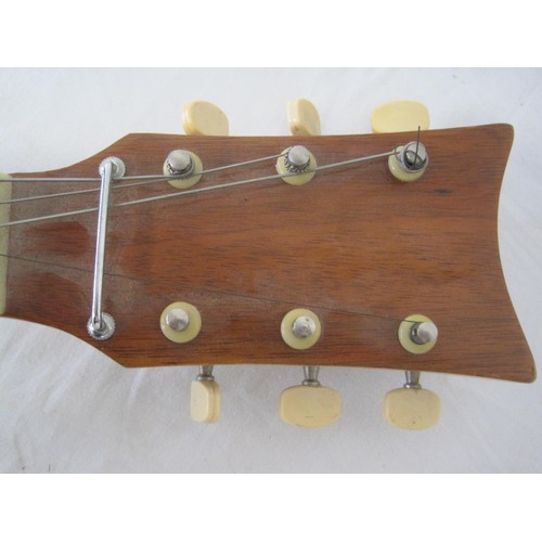 89 - An electric guitar, manufacturer name appears to be 'Kay' but wear to marking.