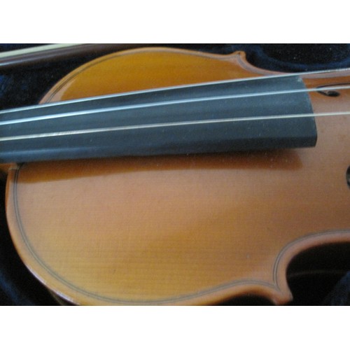 90 - A vintage cased violin, maker's name marked internally as Michael Poller, with bow.