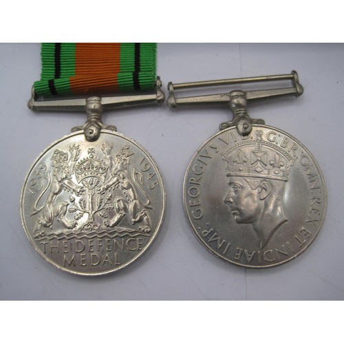 124 - WW2 Defence Medal 1939-45 (with ribbon) and 1939-45 War Medal.  With compliments slip, slip marked 1... 