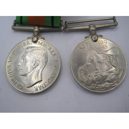 124 - WW2 Defence Medal 1939-45 (with ribbon) and 1939-45 War Medal.  With compliments slip, slip marked 1... 