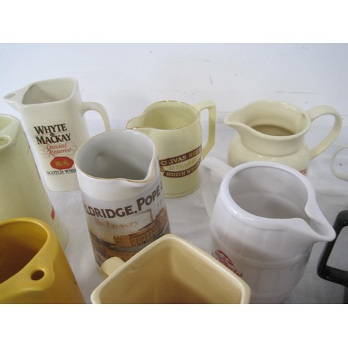 73 - Assortment of Pub Related Water Jugs. Approximately 15 in total.