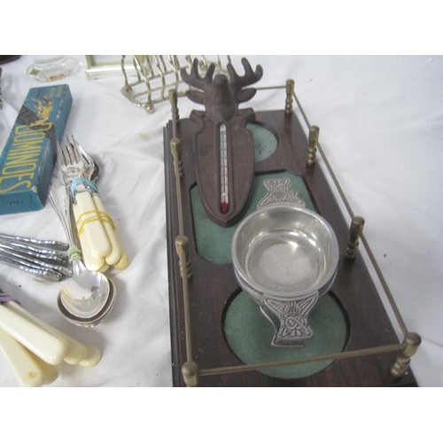 162 - A tray of interesting items including cutlery, figures, metalware etc