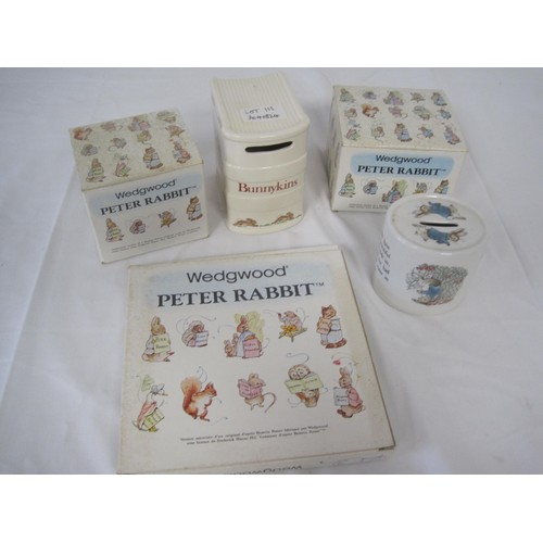 191 - Four items of Wedgwood Peter Rabbit and a Bunnykins money box. (1) Peter Rabbit two-handled mug, box... 