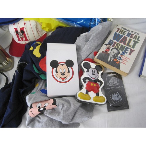 192 - A box of Walt Disney related clothing and items including two United Colors of Bennetton 'Friends of... 