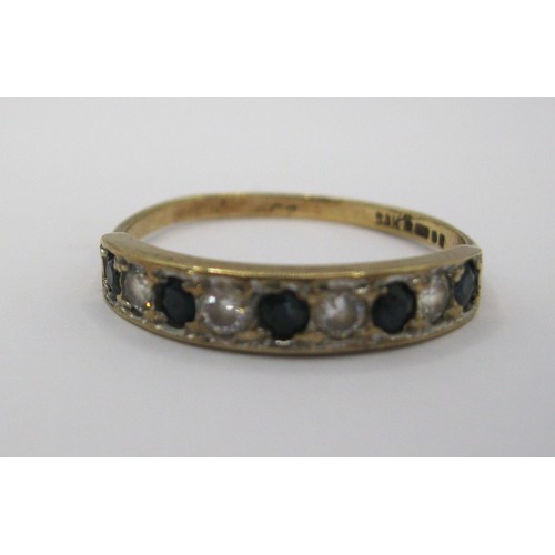 228 - A 9 carat gold eternity ring set with likely sapphires and zirconia, UK hallmarks, approx weight 1.4... 