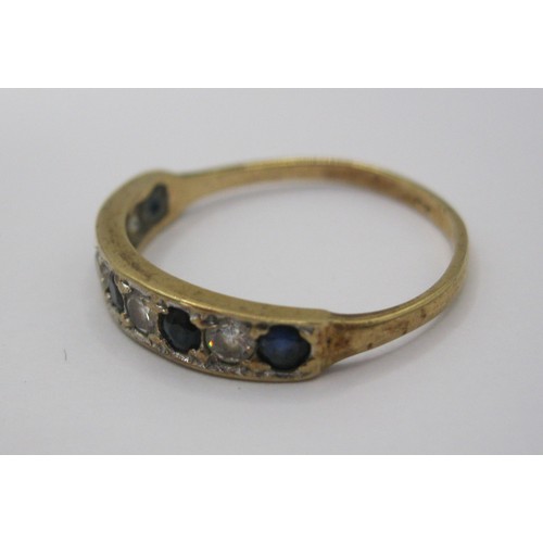 228 - A 9 carat gold eternity ring set with likely sapphires and zirconia, UK hallmarks, approx weight 1.4... 