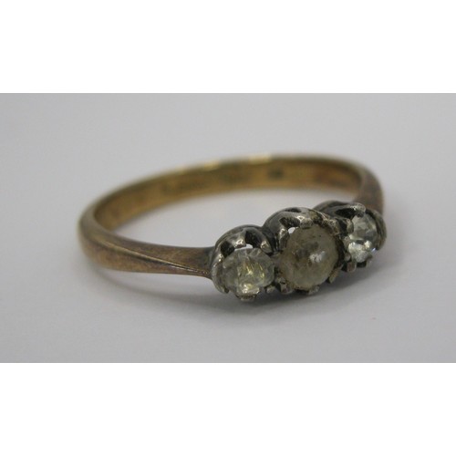 229 - A 9 carat gold ring set with 3 clear stones in a silver setting, approx weight 2.10g, ring size N