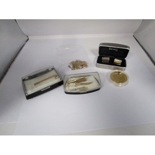 235 - Gold or gilt plated chains ,two gold coloured tiepins ,Dagger Brooch Dalaco cufflinks and a Gilt pla... 