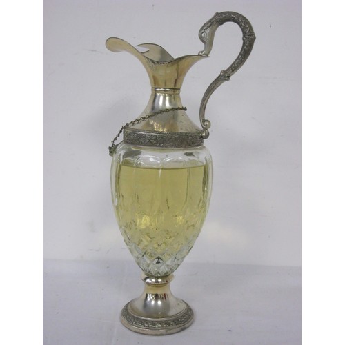 234 - A Glass Claret Style Jug containing Finest Bulgarian Whisky