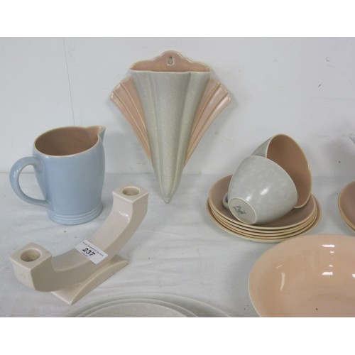 237 - Poole pottery items to include a sky blue and salmon pink jug, sepia candlestick, Seagull and salmon... 