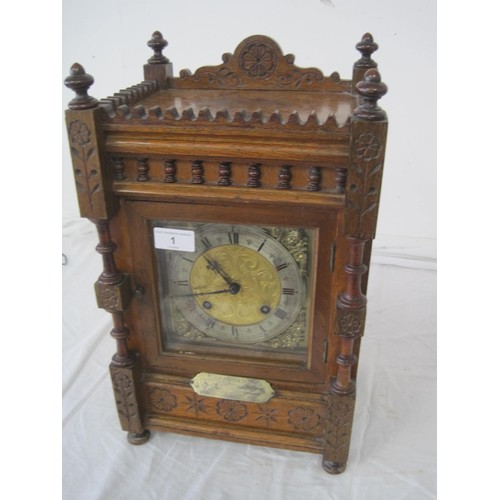 1 - An antique clock in an ornate, hand carved wooden case with silver presentation plaque to front date... 