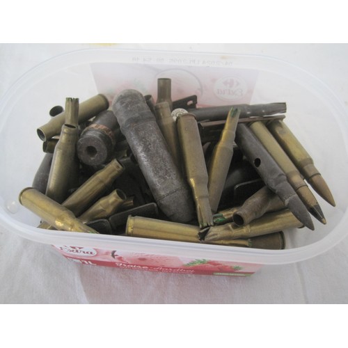 A quantity of inert ammunition, bullet heads, brass shell cases and clips.