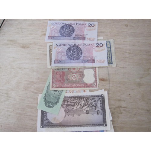 52 - A selection of Foreign Bank Notes including Brasil, Malawi, Pakistan etc.