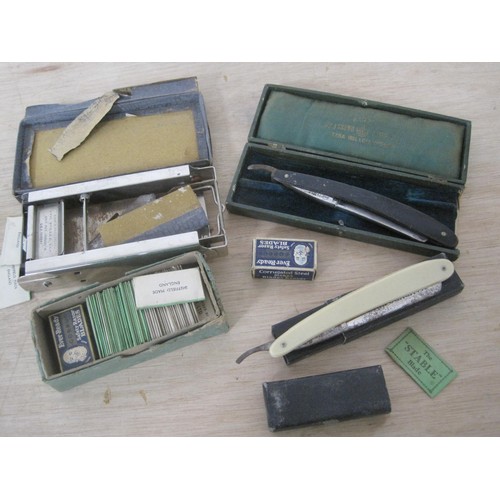 21 - Two cased cut throat razors, a quantity of unused Ever Ready razor blades, Stable blades and Double ... 