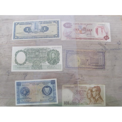 56 - A selection of UK and Foreign Banknotes, including Peru Botswana, Suriname, Madagascar etc.