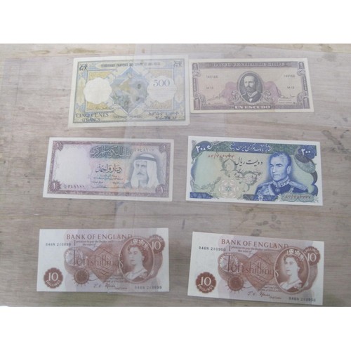 56 - A selection of UK and Foreign Banknotes, including Peru Botswana, Suriname, Madagascar etc.