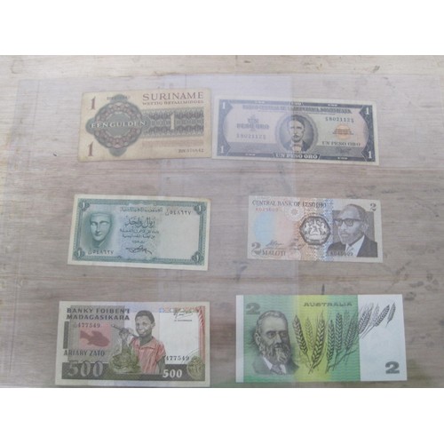 56 - A selection of UK and Foreign Banknotes, including Peru Botswana, Suriname, Madagascar etc.