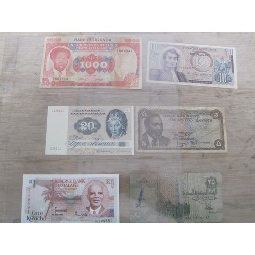 56 - A selection of UK and Foreign Banknotes, including Peru Botswana, Suriname, Madagascar etc.