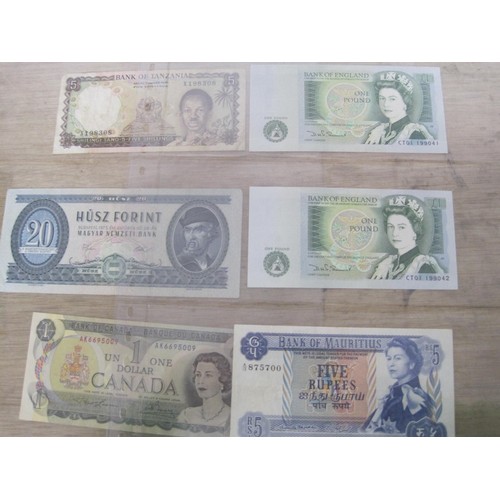 56 - A selection of UK and Foreign Banknotes, including Peru Botswana, Suriname, Madagascar etc.