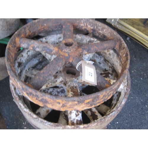 23 - H4858/77  A set of four cast iron five spoke wheels 30cms diameter.