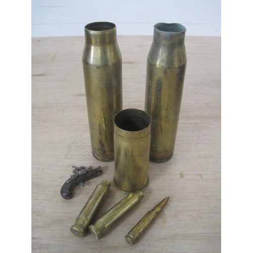 29 - A box containing a selection of shell and cartridge cases including a pair of 30mm and a German case... 